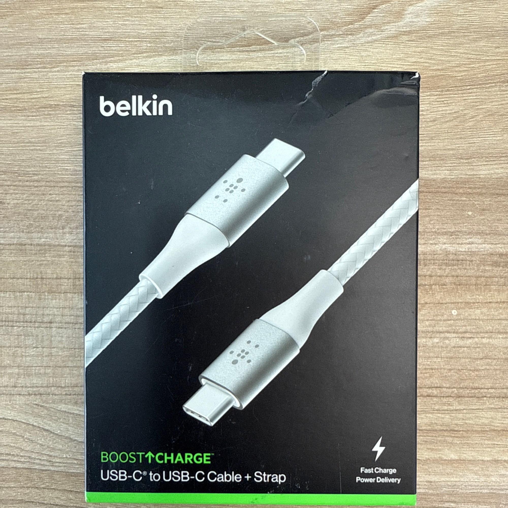 “Belkin BoostCharge braided USB-C to USB-C cable with strap, supporting fast charge and power delivery.”