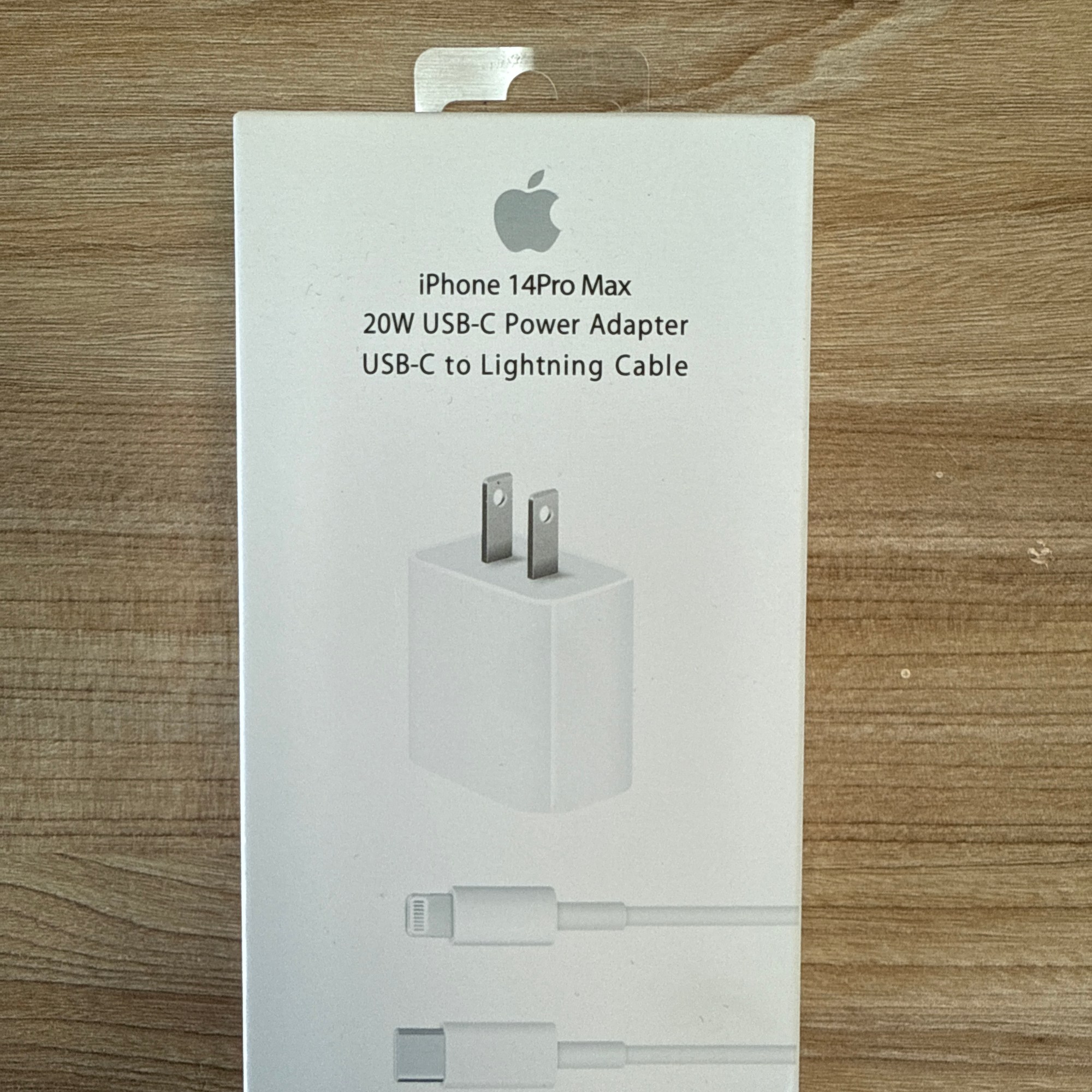 “iPhone 14 Pro Max 20W USB-C power adapter with USB-C to Lightning cable in retail packaging.”