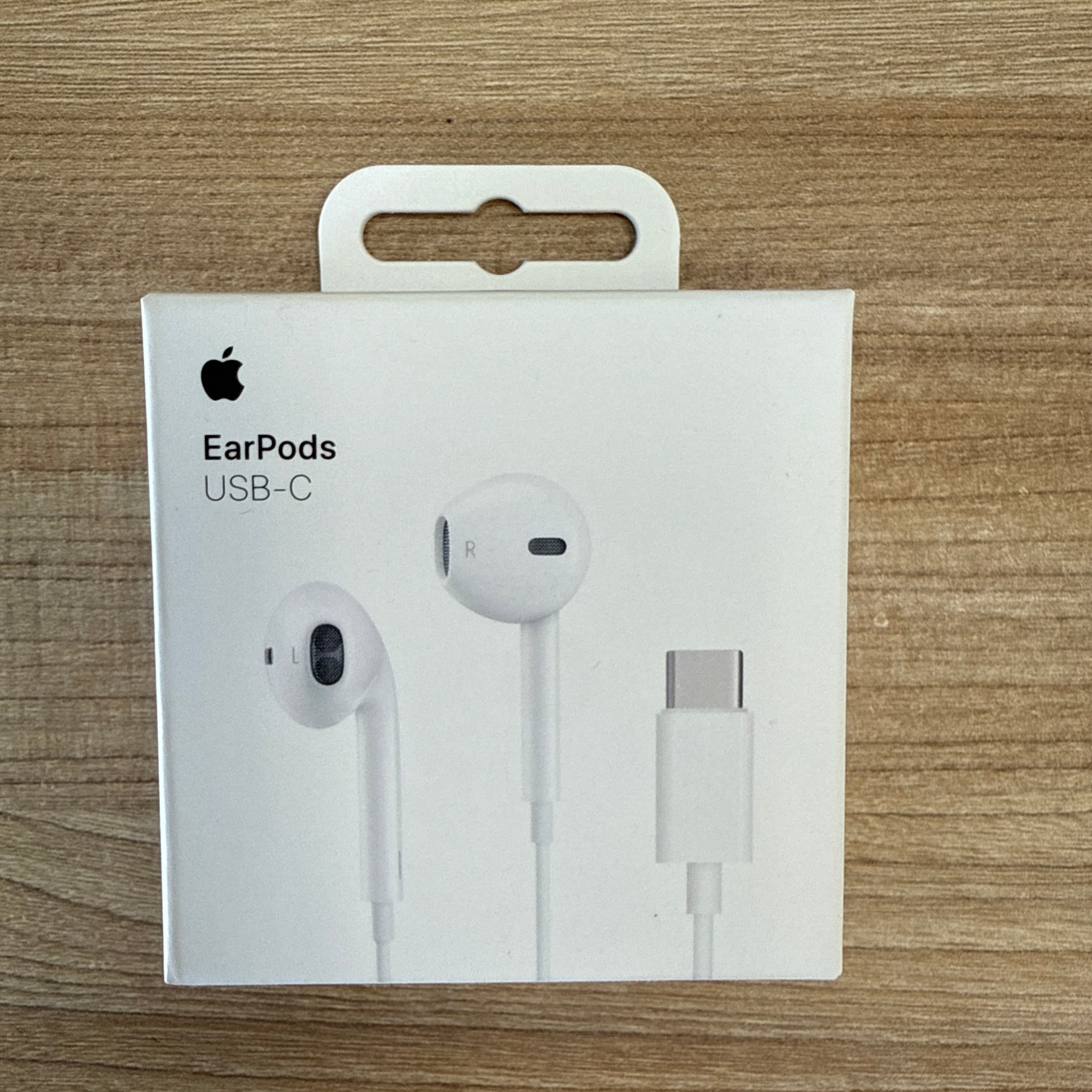 “Apple EarPods with USB-C connector in white retail packaging.”