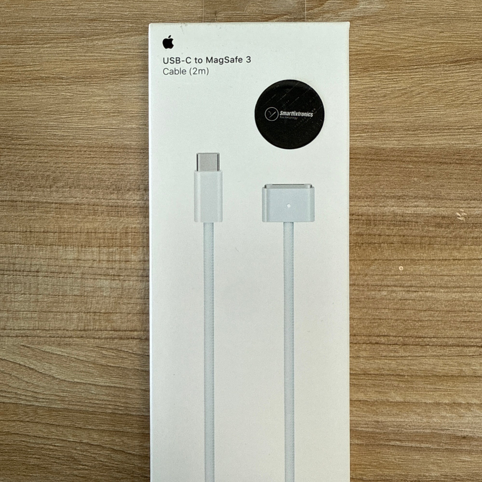 “Apple USB-C to MagSafe 3 cable, 2 meters, with Smartfixtronics seal.”