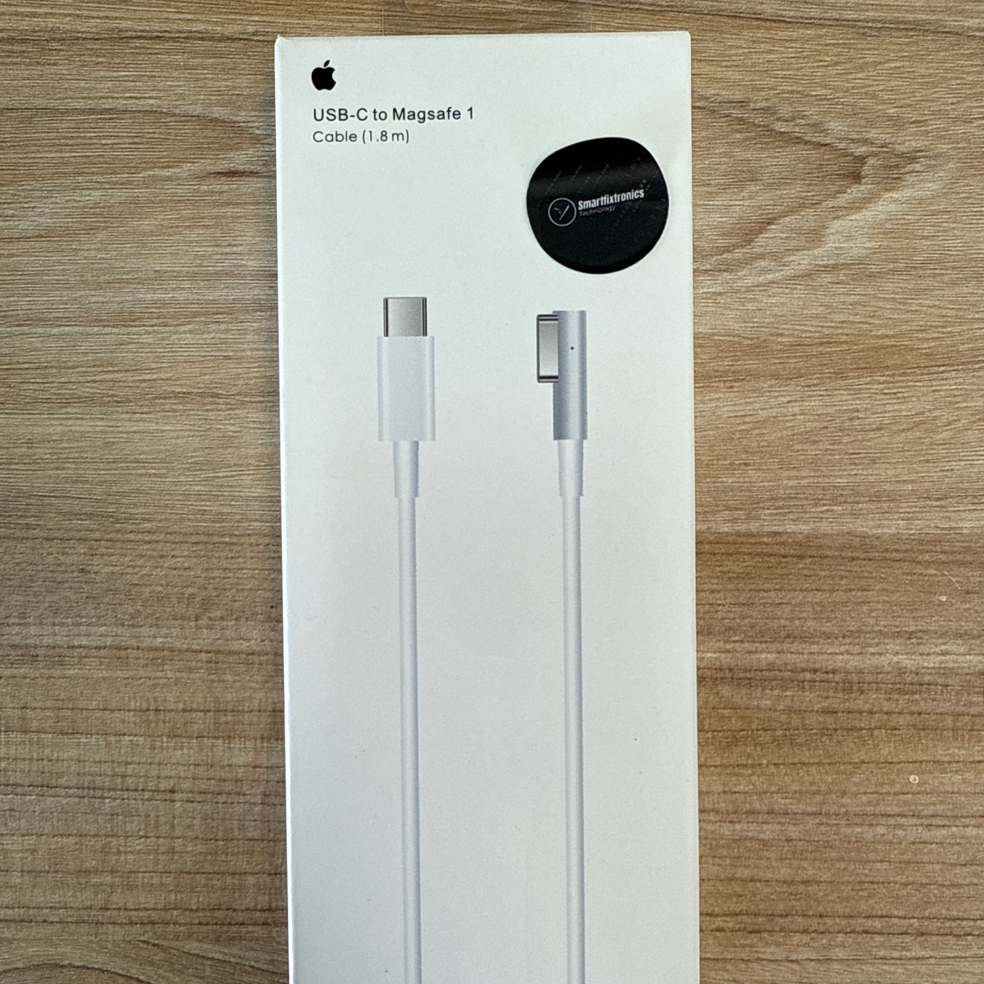 “Apple USB-C to MagSafe 1 cable, 1.8 meters, with Smartfixtronics seal.”